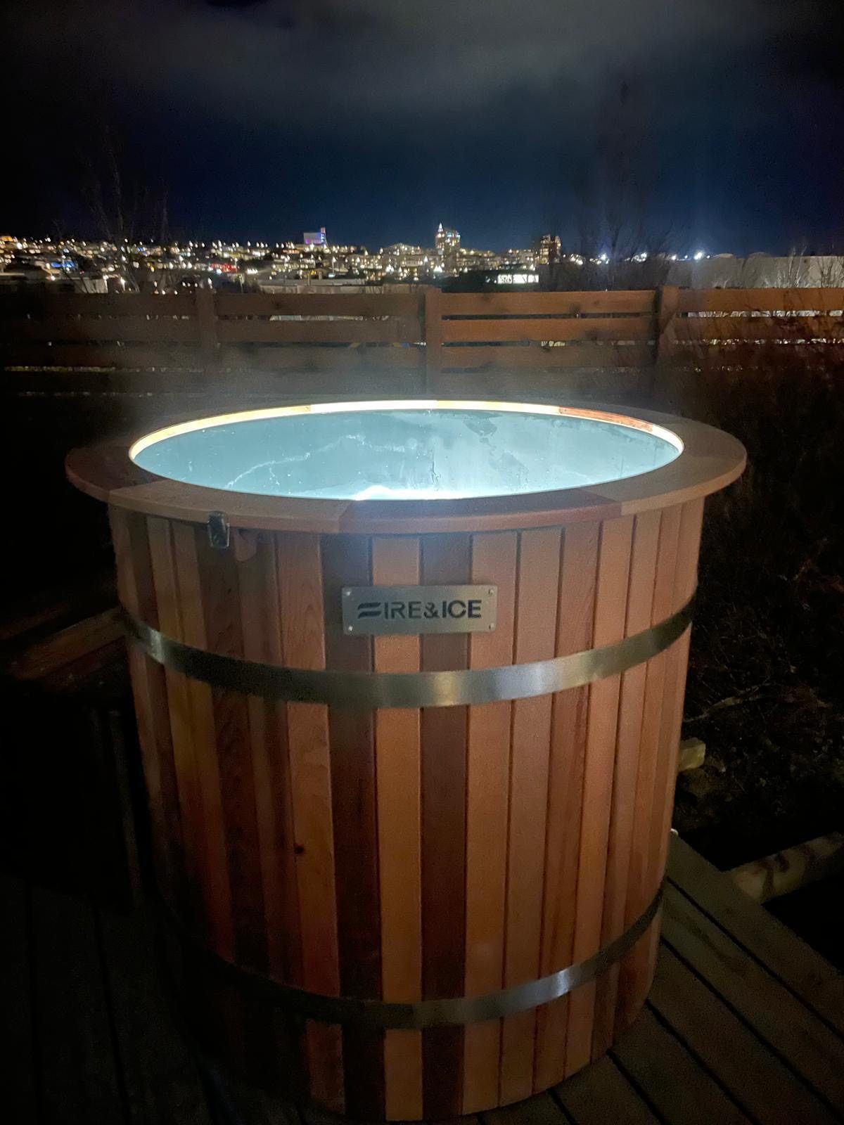 Outdoor ice bath lit at night, ready for a cold plunge