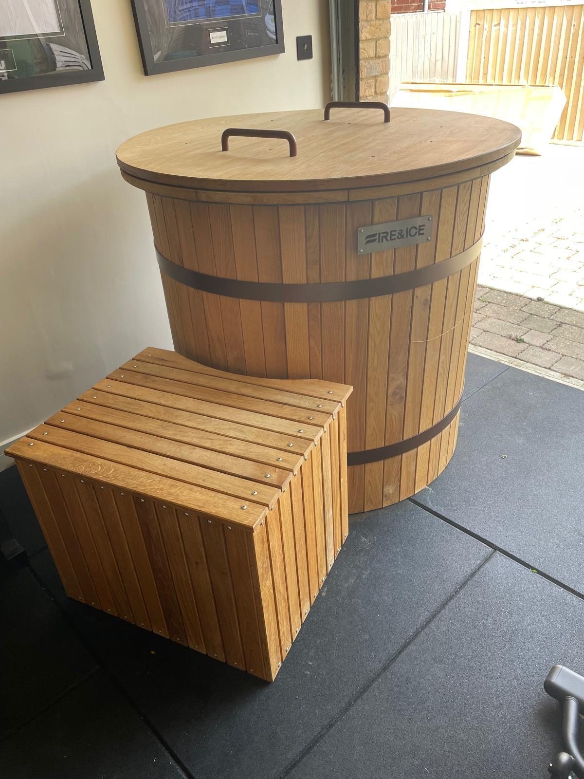 Covered timber cold plunge tub with a matching step