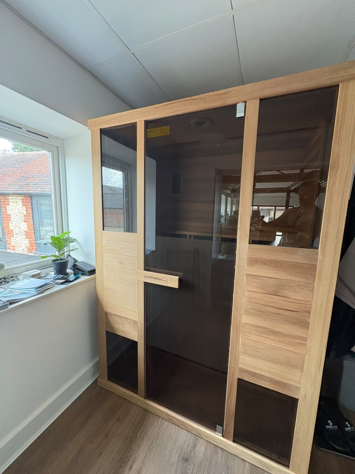 Indoor sauna cabin on display in the StarLuxe showroom