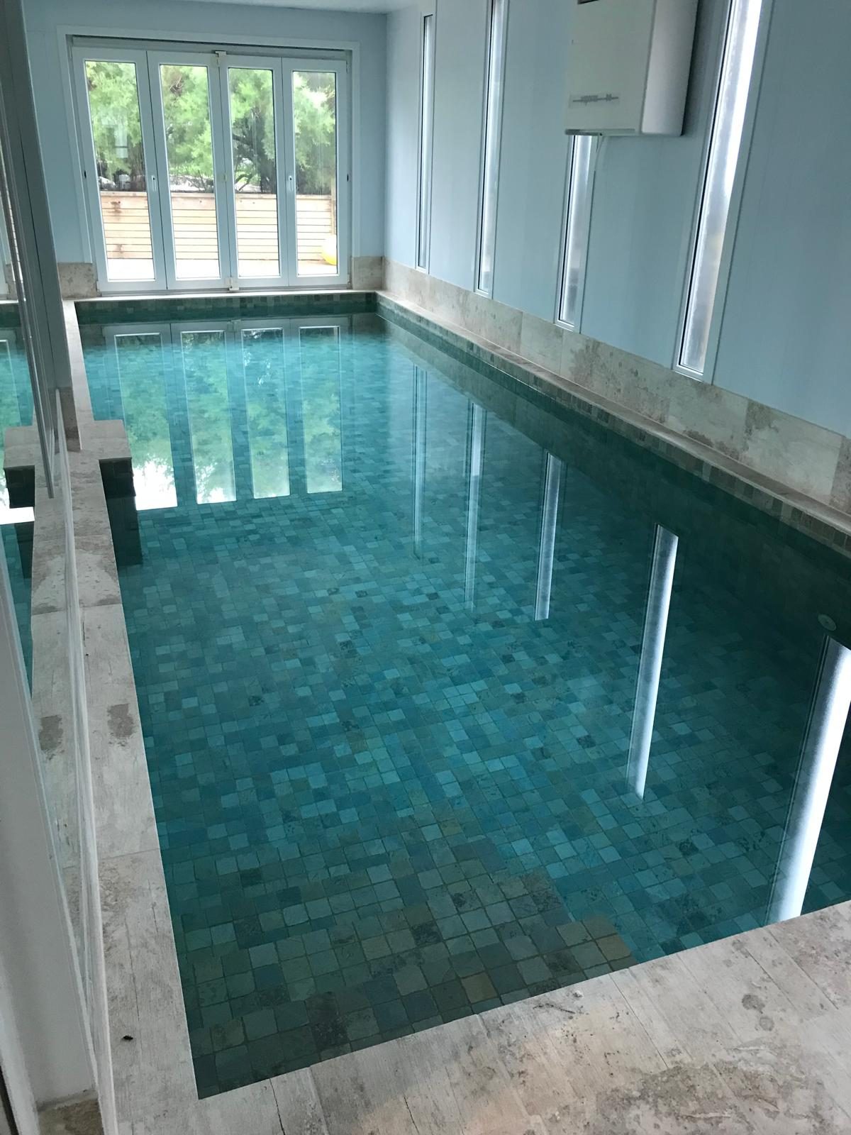 Indoor pool with green mosaic tiling